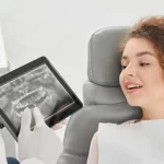 orthodontists showing patient an xray